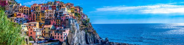 Panoramic view of colorful cityscape on the mountains over Mediterranean sea, Cinque Terre, Italy
